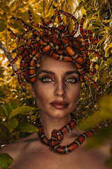 Beautiful woman as Gorgon with corn snake © Alexei