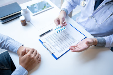 Doctor explaining and giving a consultation to a patient medical informations and diagnosis about the treatment for condition in hospital, medical ethics concept.