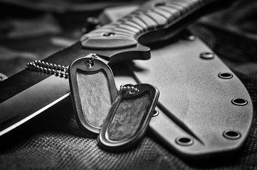 Military tokens are on the knife. The concept of the army, war, political conflict. View from above.