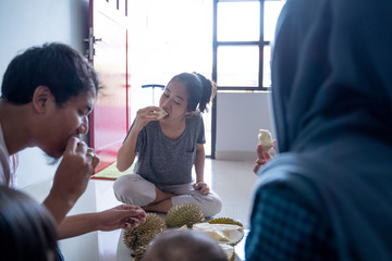 friend sharing and eat durian fruits together