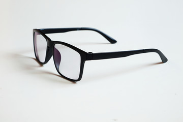 Transparent glasses, black frame isolated on a white clean background.
