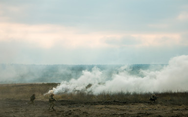 Hostilities. War concept. Military training ground with the explosions.