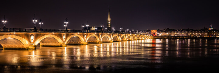 Fototapeta na wymiar Bordeaux skyline at night with the Pont de Pierre bridge and the Garonne river
