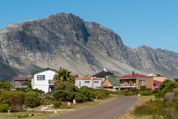 Betty's Bay, Western Cape, South Africa. December 2019. Kogelberg reserve mountains a background to houses at Betty's Bay a small community on the garden route, South Africa