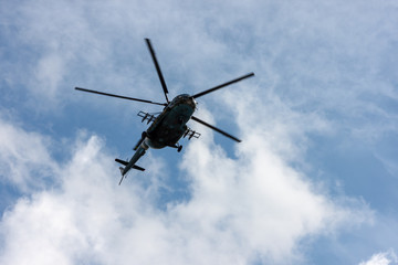 Fototapeta na wymiar Military helicopter flies in the sky