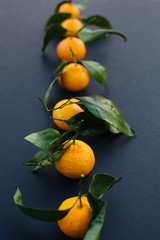 fresh mandarin oranges with green leaves