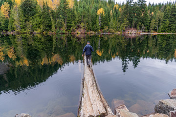 Fototapeta na wymiar View at Mountain Lake with Dramatic Clouds in British Columbia, Canada.
