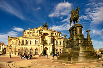 Fototapeta na wymiar Saxon State Opera Semperoper and Statue of King Johann Konig Johann on Theaterplatz in Dresden, Germany. November 2019