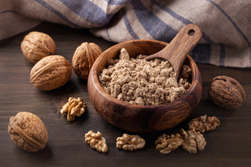 Walnut flour in the wooden bowl