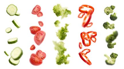 Mixed slices of cucumber, tomato, paprika and others in the air