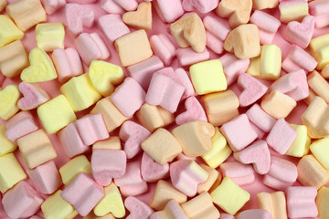Pink and yellow marshmallows. Texture, background. The concept of Valentine's Day, lovers, wedding