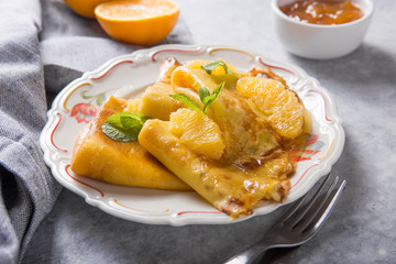 Traditional French crepe Suzette with orange sauce . top view, flat lay