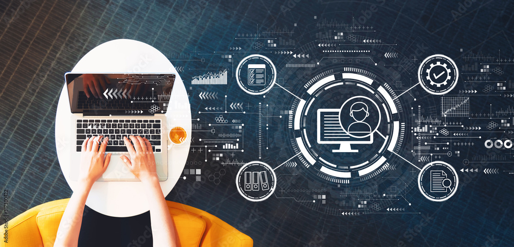 Aufkleber document management system concept with person using a laptop on a white table