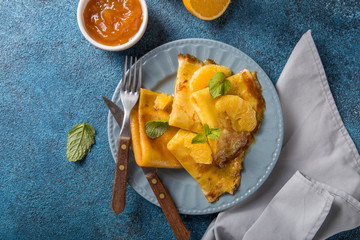 Traditional French crepe Suzette with orange sauce . top view, flat lay