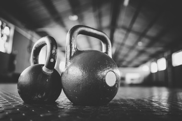 Close up image of kettle bell weights in a gym