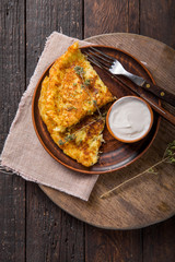Irish Potato pancakes, latkes or boxty and sauces on wooden background
