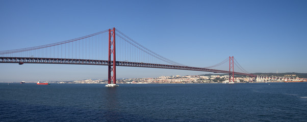 Lisbon 25th of April bridge panorama seen from water level