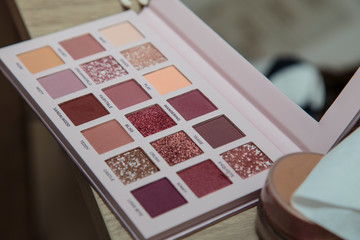 Makeup palette of various colors. With selective blur in the image.