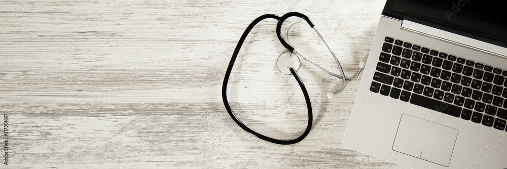 Aufkleber stethoscope with computer on the desk background