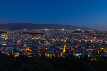 Naklejka premium Night view of the city from Filopappos Hill in the evening, Athens, Greece
