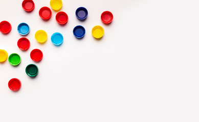 Colored frame plastic covers from bottles isolated on white