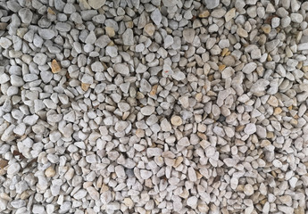 texture of many yellow and white stones. background of stone heap