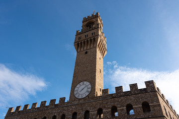 view of the old building facade with bell tower in Florence Tuscany