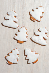 Handmade festive gingerbread cookies in the form of stars,staff,Christmas trees.on a light countertop.