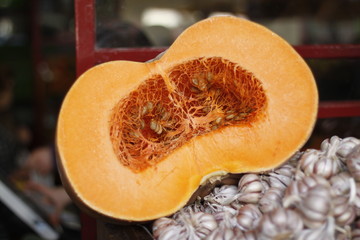 half pumpkin on a wooden table at the market in Funchal 