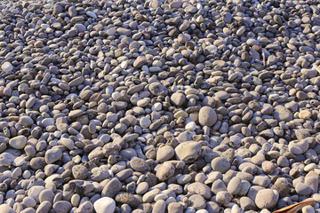 Nature background from gray sea pebbles