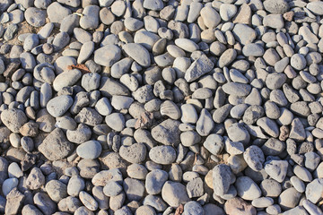 Nature background from gray sea pebbles