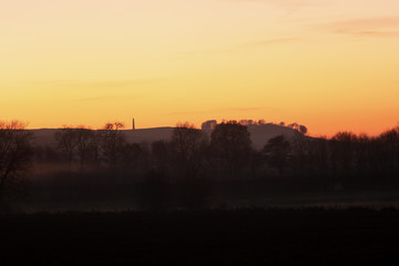 Sunset over a misty river