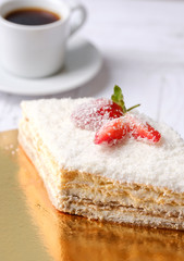 Tasty piece of sweet strawberry cake with red berries on cup of coffee americano, white background. Homemade delicious organic dessert sugarless. Healthy eating.