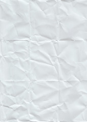 Folded and crumpled paper. Seamless pattern with a texture of folded and crumpled white paper.