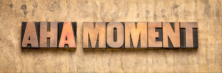 aha moment word abstract in wood type