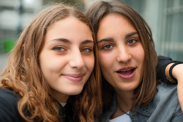 Portrait of smiling teenage female friends