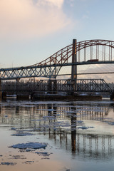 Beautiful View of Fraser River and Pattullo Bridge in the City during a cold and icy winter sunset. Taken in New Westminster, Vancouver, British Columbia, Canada.