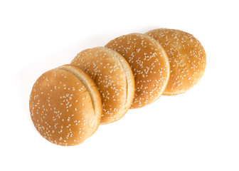 Burger buns on white background. A few buns cut in half close up on a white background.