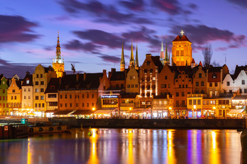 Fototapeta na wymiar Old Town of Gdansk, Dlugie Pobrzeze, Bazylika Mariacka or St Mary Church, City hall and Motlawa River at night, Poland