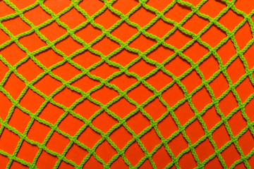 textile mesh, green and orange color, texyured background