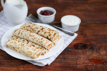 Pancakes with homemade cottage cheese. Sour-milk fermented product. Healthy, delicious breakfasts. With sour cream and raspberry jam.