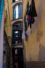 Fototapeta na wymiar Cinque Terre, Italy, December 5, 2019. Clothes to dry hanging in the windows.