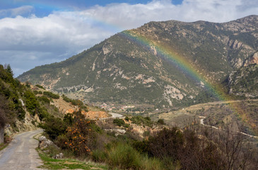 Fototapeta na wymiar The rainbow in the mountains