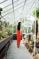 Beautiful woman during Spring time in a greenhouse