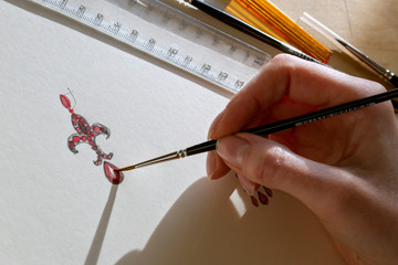 Artist  designer drawing sketch jewelry on paper . Drawing Jewelry Design.  Design Studio. Creativity Ideas.