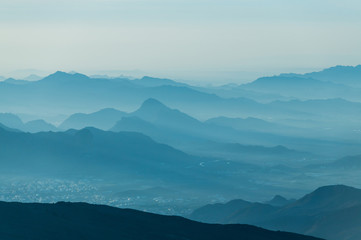 Mountain range background in blue  morning haze