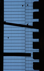 Abstract exterior of apartment building windows and balconies.