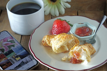 breakfast with coffee and croissant