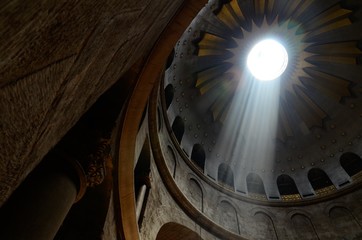 Low angle shot of the light coming from the ceiling in a historic Cathedral in Jerusalem