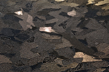 Odd ice structure after several melting and icing. Ice reflecting sunlight